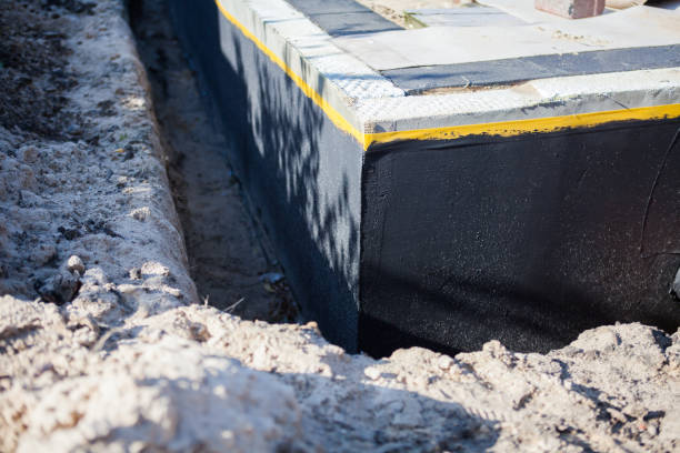 Professional Basement Waterproofing technician working in Mooresville, IN